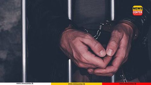 Two people were detained for armed robbery at a liquor store, including a police officer.